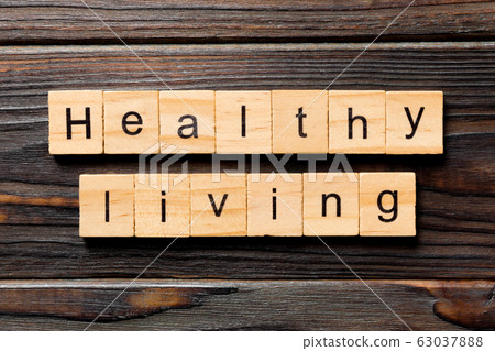 Healthy Living word written on wood block. Healthy Healthy Living word written on wood block. Healthy 63037888