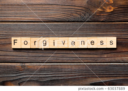 forgiveness word written on wood block. forgiveness word written on wood block. 63037889