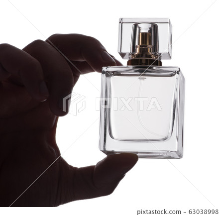 Sexy man with bottle of perfume 63038998