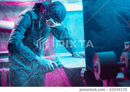 Skater in process of making his own skateboard, longboard - open business concept Skater in process of making his own skateboard, longboard - open business concept 63039178