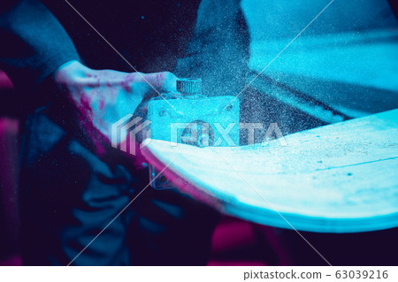 Skater in process of making his own skateboard, longboard - open business concept Skater in process of making his own skateboard, longboard - open business concept 63039216