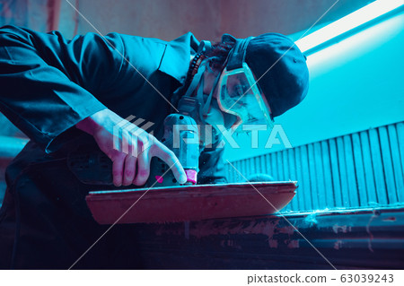 Skater in process of making his own skateboard, longboard - open business concept Skater in process of making his own skateboard, longboard - open business concept 63039243