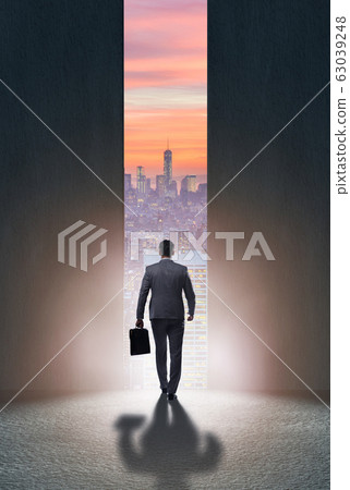 Businessman walking towards his ambition 63039248