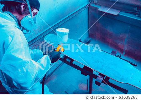 Skater in process of making his own skateboard, longboard - open business concept Skater in process of making his own skateboard, longboard - open business concept 63039265