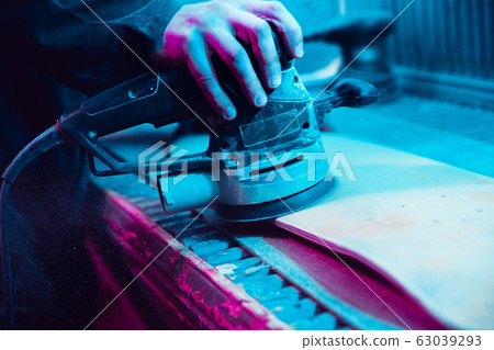 Skater in process of making his own skateboard, longboard - open business concept 63039293