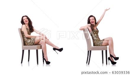 Woman sitting on the chair isolated on white 63039336