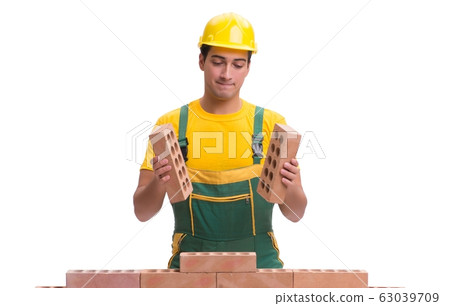 The handsome construction worker building brick wall The handsome construction worker building brick wall 63039709