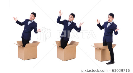 Businessman with box isolated on the white 63039716