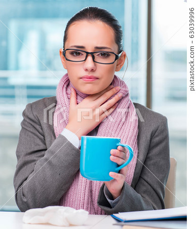 Young businesswoman sick in the office Young businesswoman sick in the office 63039996