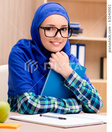 Muslim girl preparing for entry exams Muslim girl preparing for entry exams 63040001