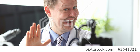Cheerful doctor at workplace Cheerful doctor at workplace 63041321