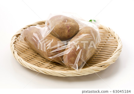 Crimson potato with soil bag 63045184