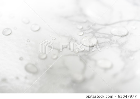 Water drops on marble surface 63047977
