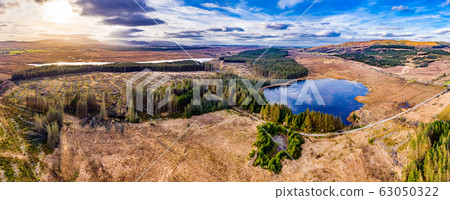 Aerial view of peatbog next to the town Glenties in County Donegal - Ireland Aerial view of peatbog next to the town Glenties in County Donegal - Ireland 63050322