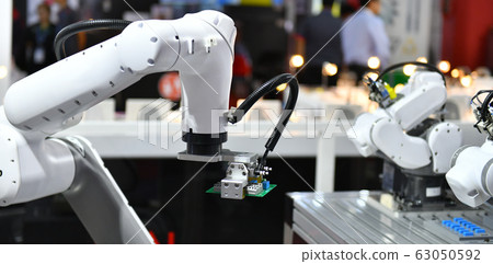 Industrial Robotic Arm for holding Electronic circuit board production in machinery and technology 63050592