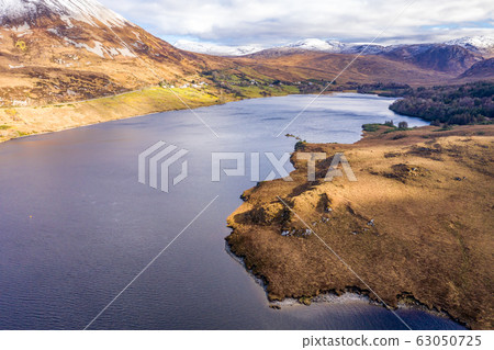 Aerial view of Dunlewey Lough at the bottom of Mount Errigal - County Donegal, Ireland Aerial view of Dunlewey Lough at the bottom of Mount Errigal - County Donegal, Ireland 63050725
