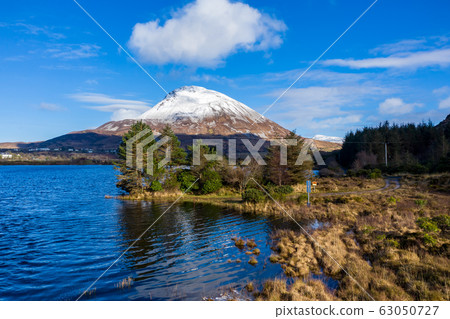 Aerial view of Mount Errigal, the highest mountain in Donegal - Ireland Aerial view of Mount Errigal, the highest mountain in Donegal - Ireland 63050727