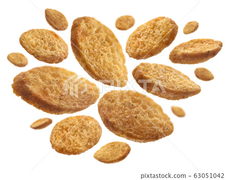 Bread croutons levitate on a white background Bread croutons levitate on a white background 63051042