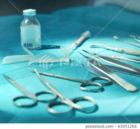 Surgical instruments, silicone nasal implant in operating room. Surgical instruments, silicone nasal implant in operating room. 63051268