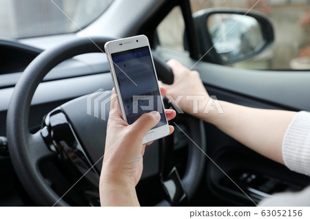 Driving while smartphone Driving while smartphone 63052156