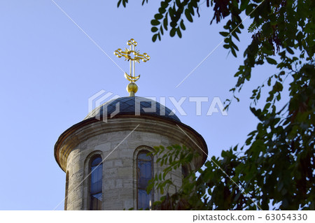 The main attraction of the city of Kerch is the Golden cross on the Church of St. John the Baptist. Photo taken on October 13, 2018. The main attraction of the city of Kerch is the Golden cross on the Church of St. John the Baptist. Photo taken on October 13, 2018. 63054330