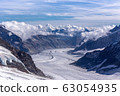 Great Aletsch glacier world heritage of Swiss and Bernese Alps and jungfrau snow mountain peak view from Jungfraujoch top of Europe with blue sky in summer background and copy space Switzerland 63054935