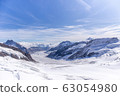 Great Aletsch glacier world heritage of Swiss and Bernese Alps and jungfrau snow mountain peak view from Jungfraujoch top of Europe with blue sky in summer background and copy space, Switzerland 63054980