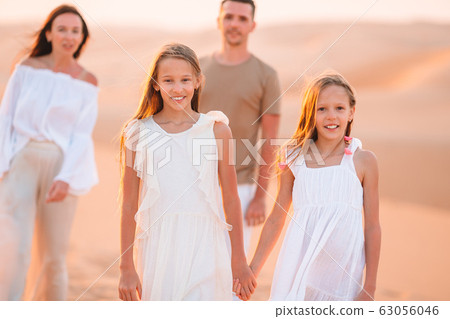 People among dunes in desert in United Arab Emirates 63056046