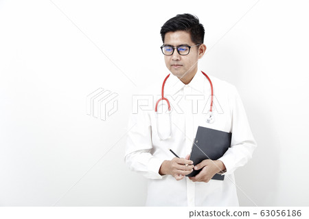 Male doctor on the document clipboard Male doctor on the document clipboard 63056186