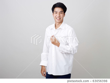 young asian handsome businessman on wall 63056398