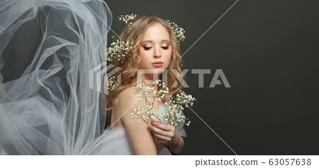 Beautiful woman with white tulle on black banner 63057638