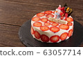 Christmas cake decorated with strawberries on the surface 63057714