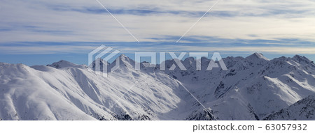 Panorama of snowy slope in high winter mountains Panorama of snowy slope in high winter mountains 63057932
