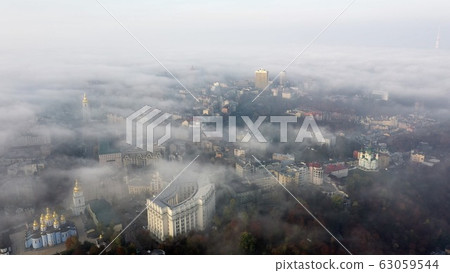 Aerial view of the city in the fog 63059544