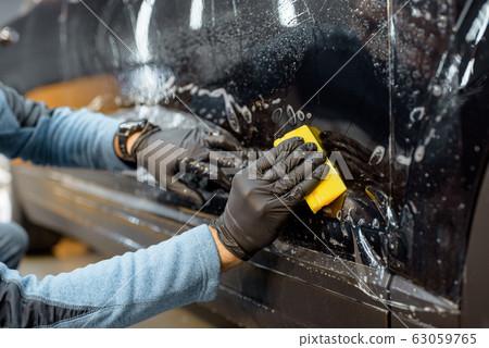 Filming car body at the vehicle service Filming car body at the vehicle service 63059765