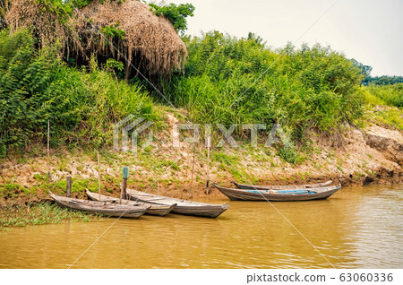 Wooden boats at mooring on river bank in Santarem, Wooden boats at mooring on river bank in Santarem, 63060336