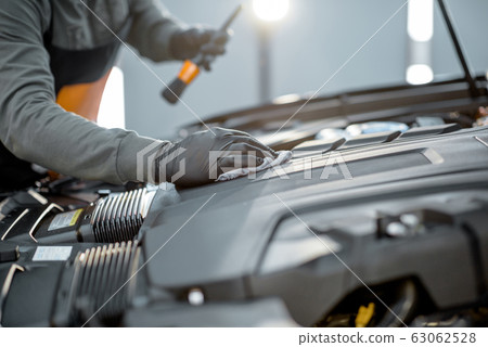 Professional car engine cleaning 63062528