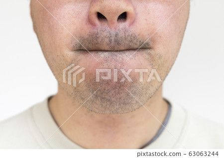 Mouth of a stubble man Mouth of a stubble man 63063244