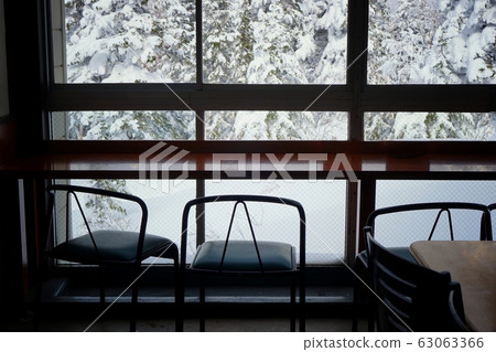 Table with snow Table with snow 63063366