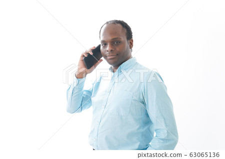 Black man using smartphone 63065136