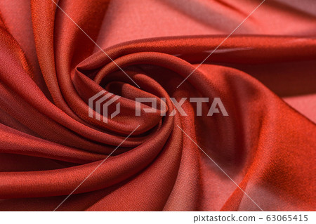 Shiny red cloth background dark curly background Shiny red cloth background dark curly background 63065415