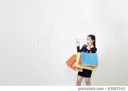 Happy Woman with Shopping Bags White Background 63065543
