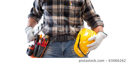 Electrician with tool belt on a white background. Electrician with tool belt on a white background. 63066262