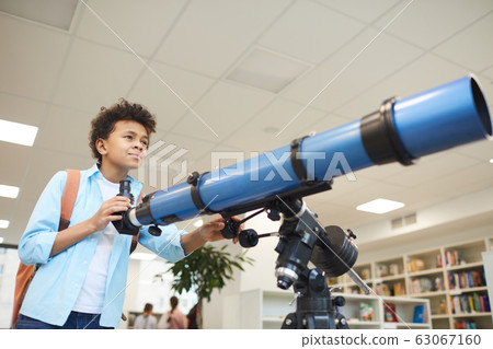 African American Boy With Telescope 63067160