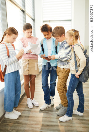 Five Classmates Talking About Homework 63067372