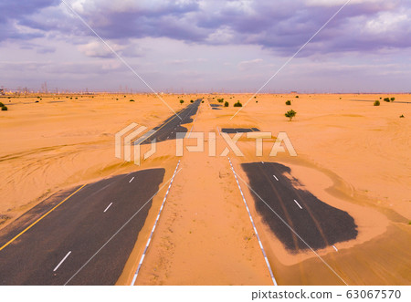 Aerial view of half desert road or street with 63067570
