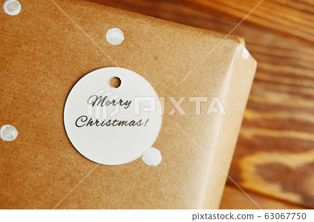 Little tag with Christmas wishes and gifts. Little tag with Christmas wishes and gifts. 63067750