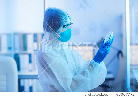 Unrecognizable Scientist Holding Petri Dish 63067772
