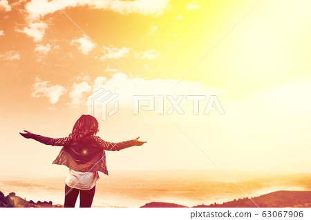 Beauty woman outdoors enjoying nature. 63067906