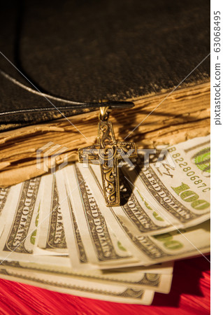 Money in book, church tethe concept. 63068495